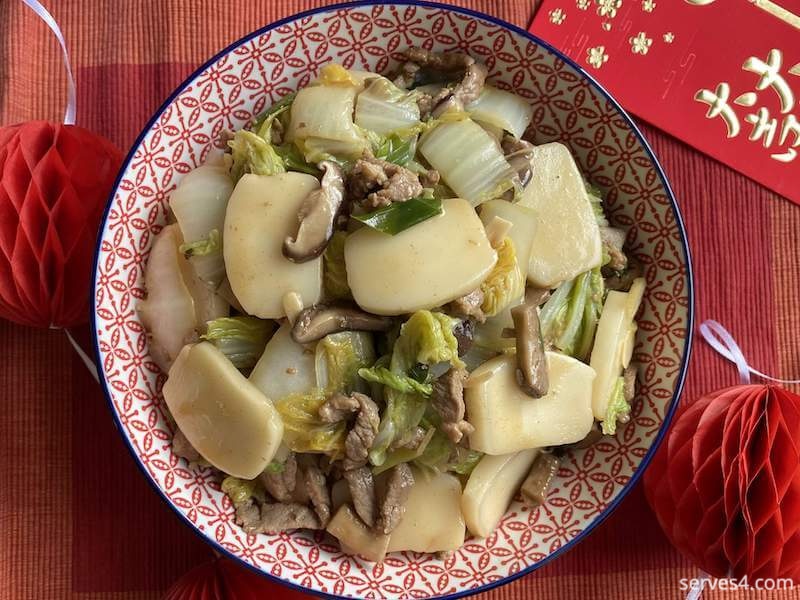 Chinese Rice Cake Stir Fry is one of the traditional lucky foods eaten at Chinese New Year, although it is popular to eat at any time of year.