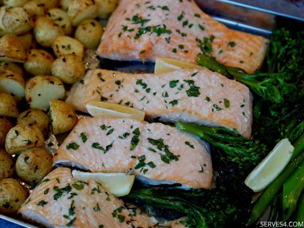 This sheet pan garlic baked salmon recipe is one of those one tray wonders that will keep you coming back time after time.
