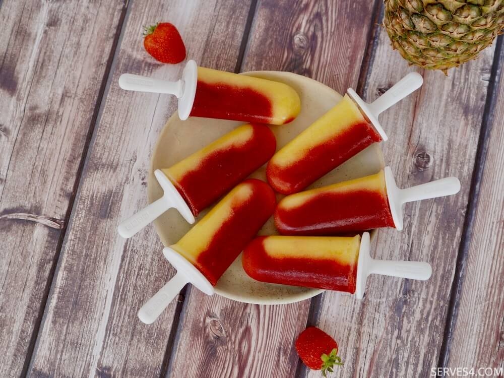 These pineapple ice pops with strawberry are not only pretty to look at, but they are also a tasty way to cool down in the heat!